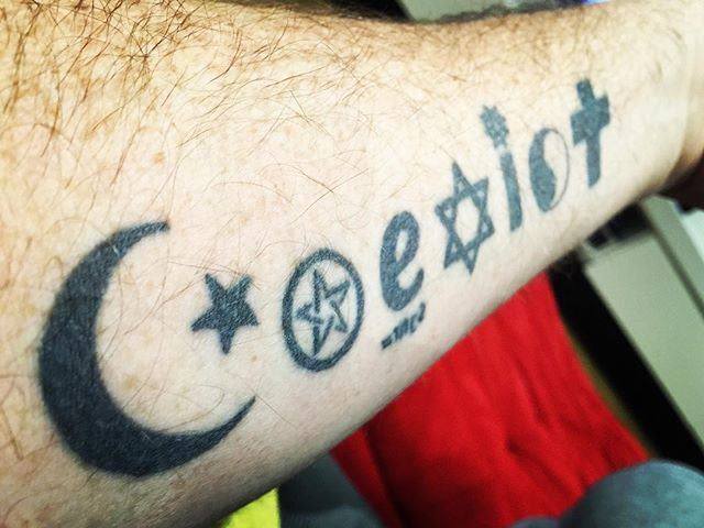 My uncle's tatoo - people of all belief systems and religions CAN coexist in harmony.